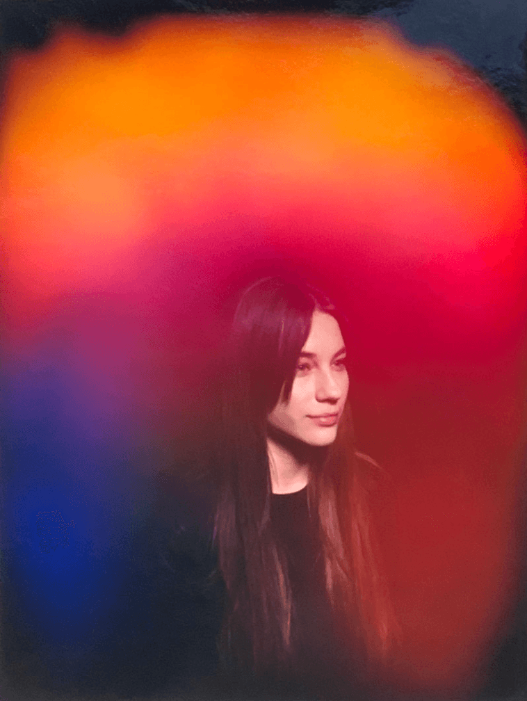 Aura portrait of a person with long dark hair surrounded by a fiery orange-and-blue aura